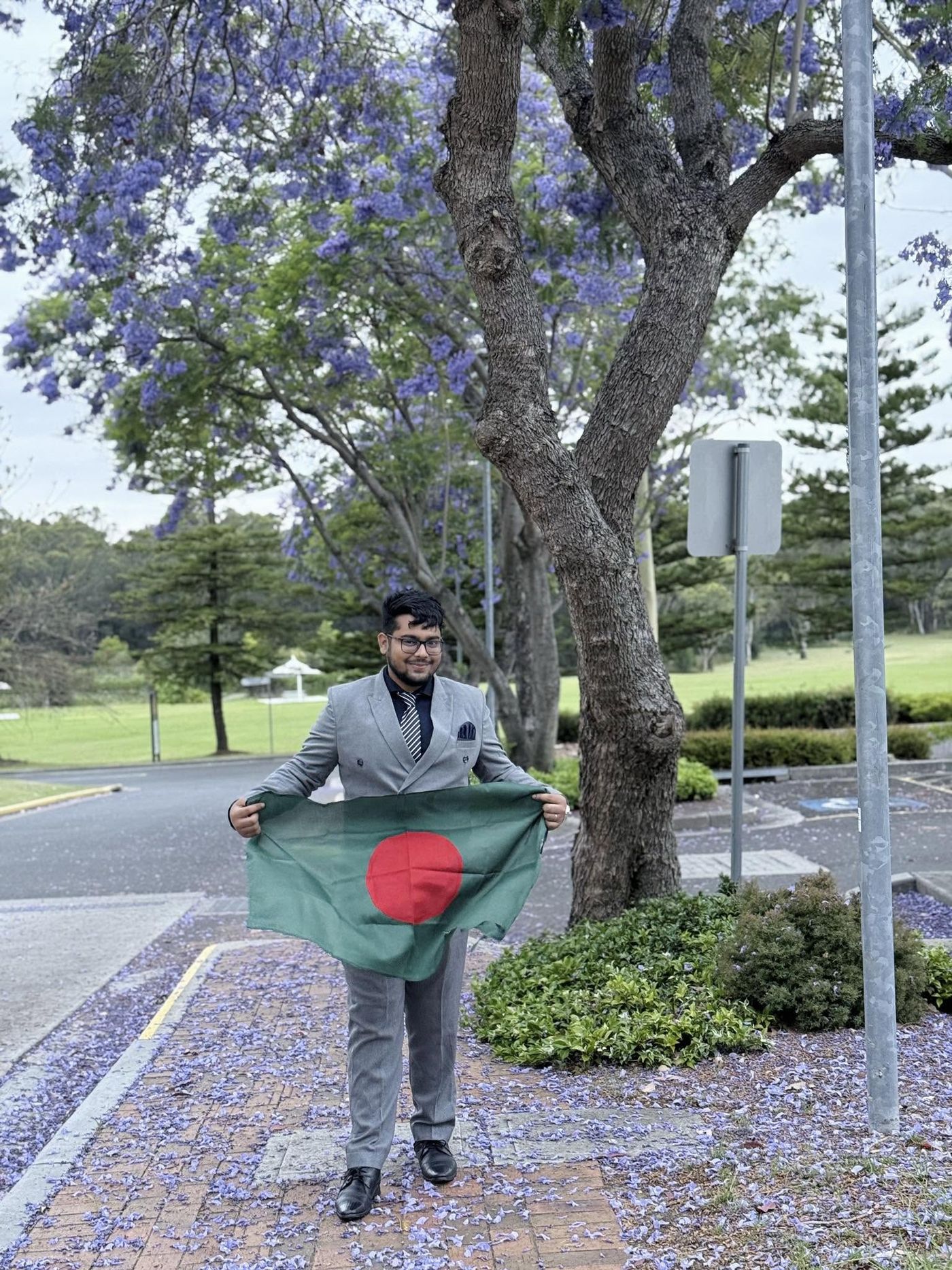 Fahim holding the Bangladesh flag on the Western Sydney University campus