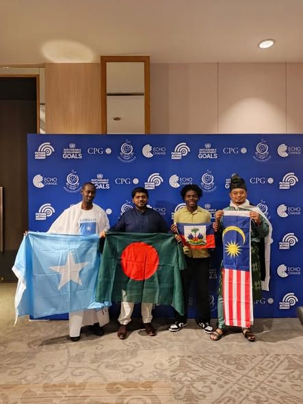 Delegates holding national flags at the summit